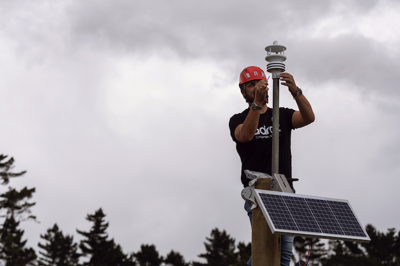 Founder of Adroit installing a weather station